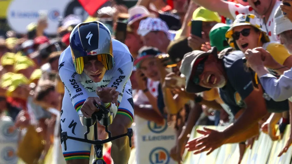 Untouchable Evenepoel wins time trial; podium contender Lipowitz abandons Tour
